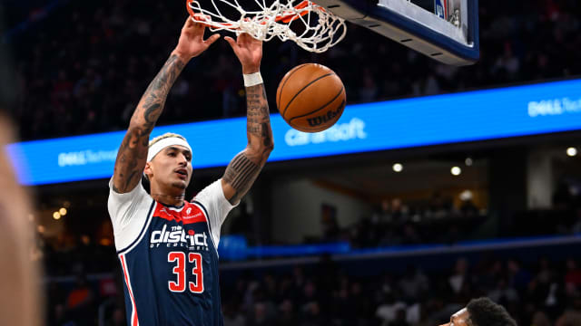 Washington Wizards forward Kyle Kuzma (33) dunks the ball against the Atlanta Hawks during the second half at Capital One Arena.